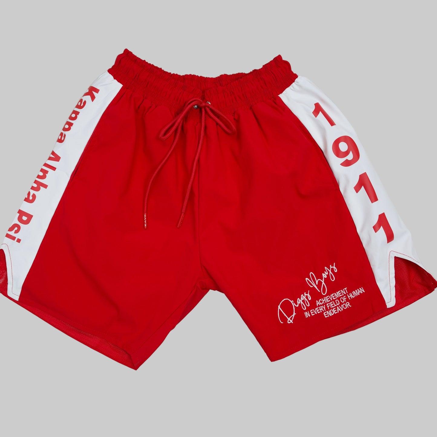 Red shorts with white accents and text on a light gray background