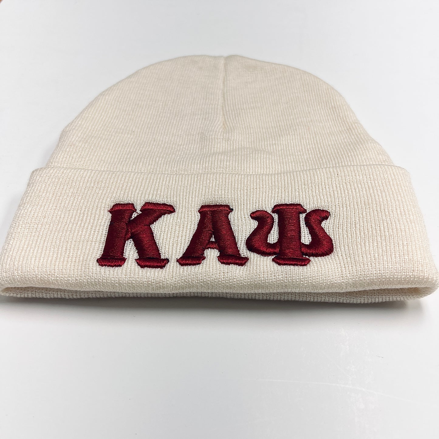 Show off your love for Kappa Alpha Psi with this cream beanie. This collectible item is a perfect addition to your historical memorabilia collection. Represent your favorite fraternal organization with pride and add this beanie to your wardrobe today. Perfect for any occasion, this beanie is sure to spark conversations and show off your unique style.