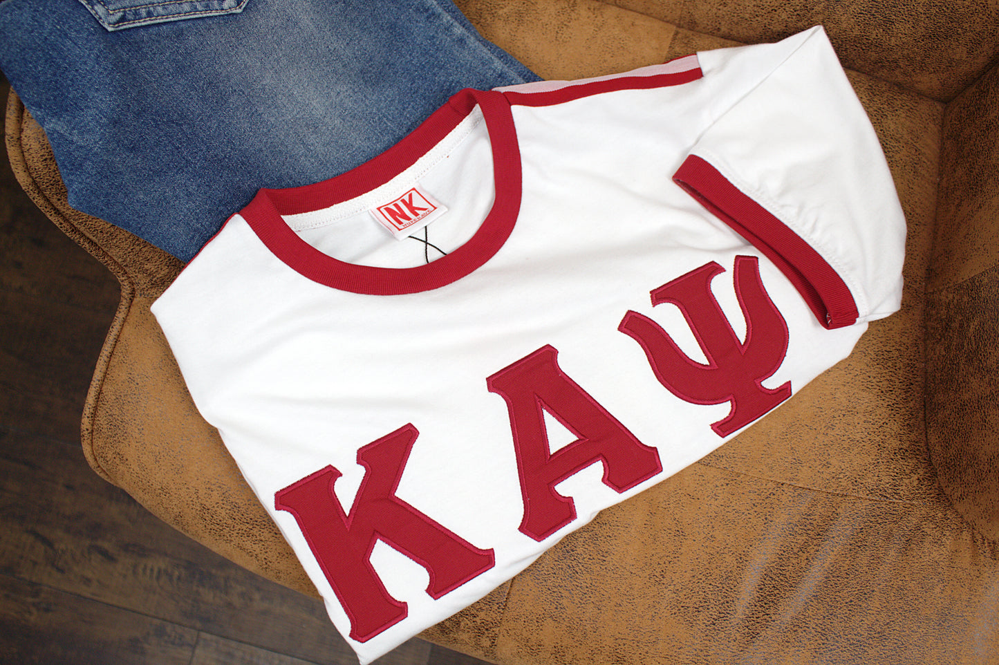 The shirt is perfect for those who appreciate quality and style. It is a great addition to any collection and is sure to turn heads. Whether you're dressing up or down, this Kappa Alpha Psi Shoulder Stripe T-Shirt is a versatile piece that can be worn for any occasion.
