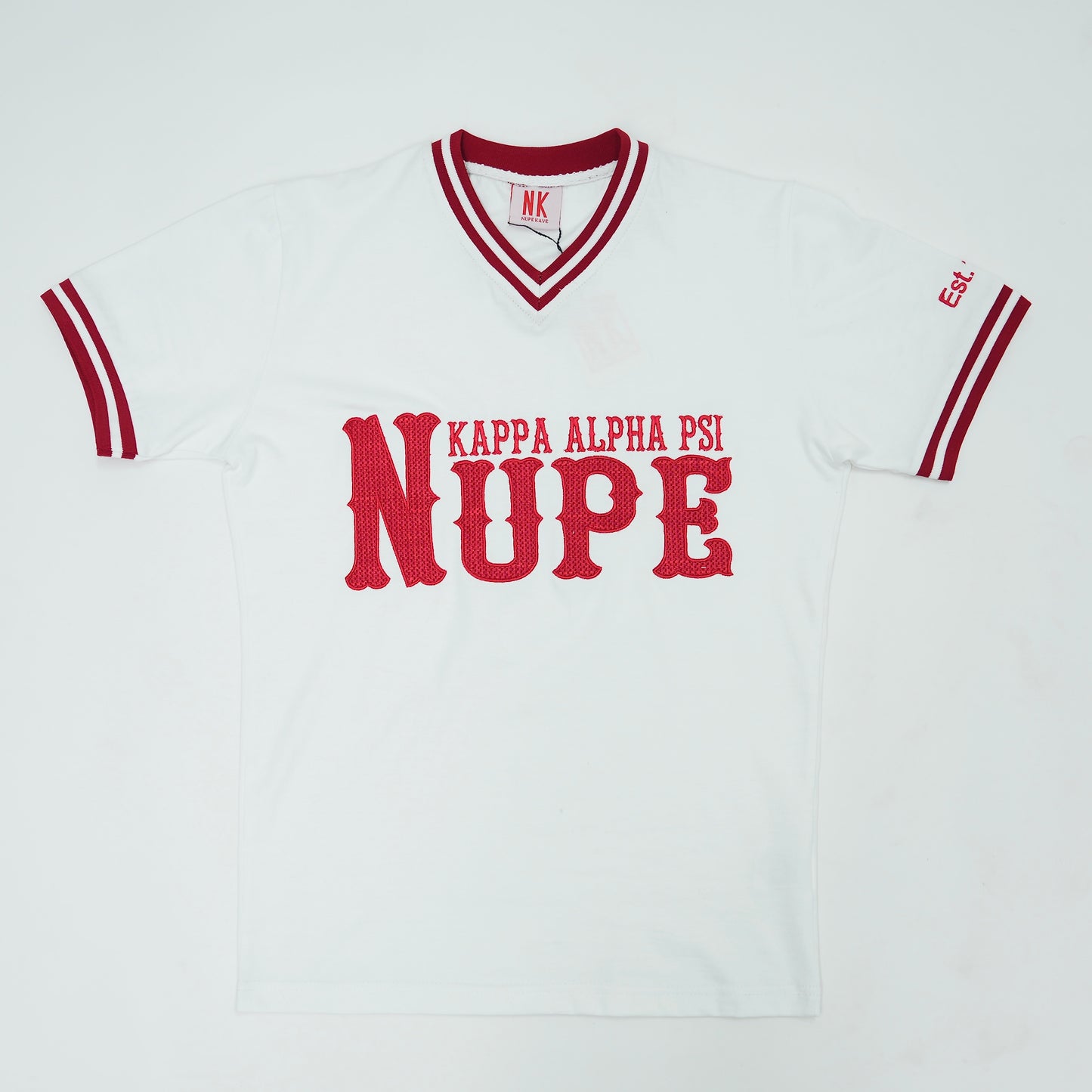 White jersey with red lettering and accents, featuring 'Kappa Alpha Psi NUPE' on a white background.The Kappa Alpha Psi "Nupe" T-shirt is a collectible item that represents the historical significance and traditions of the fraternity . It serves as a symbol of pride and belonging for members and supporters of Kappa Alpha Psi. This t-shirt is a unique piece of memorabilia that showcases the unique cultural heritage and shared values of those involved in the organization.