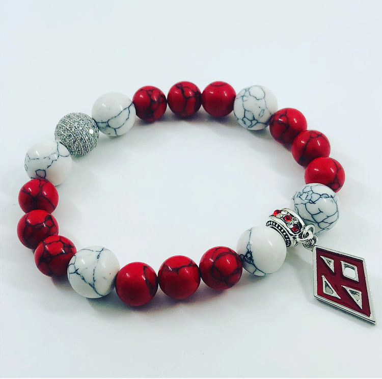 Kappa Alpha Psi fraternity exclusive Glass Beaded Bracelet on elastic stretch rope; simple and elegant. Easy bracelet to slide on and off wrist. The color of amber beads may vary from bracelet to bracelet due to each bracelet being hand made from natural materials with a personal touch.