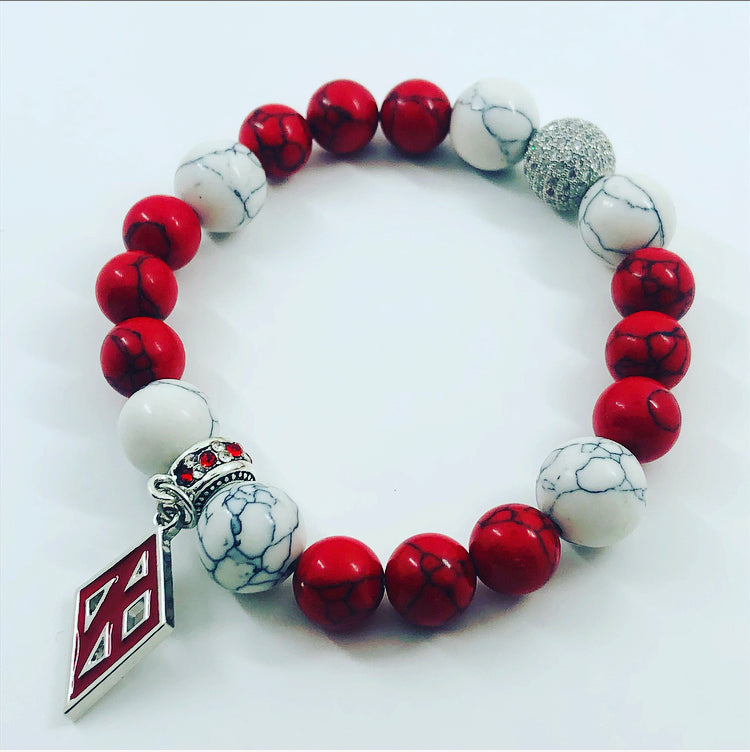 Kappa Alpha Psi fraternity exclusive Glass Beaded Bracelet on elastic stretch rope; simple and elegant. Easy bracelet to slide on and off wrist. The color of amber beads may vary from bracelet to bracelet due to each bracelet being hand made from natural materials with a personal touch.