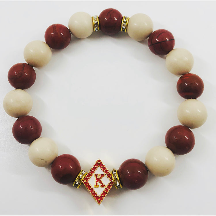 Kappa Alpha Psi fraternity exclusive Glass Beaded Bracelet on elastic stretch rope; simple and elegant. Easy bracelet to slide on and off wrist. The color of amber beads may vary from bracelet to bracelet due to each bracelet being hand made from natural materials with a personal touch.