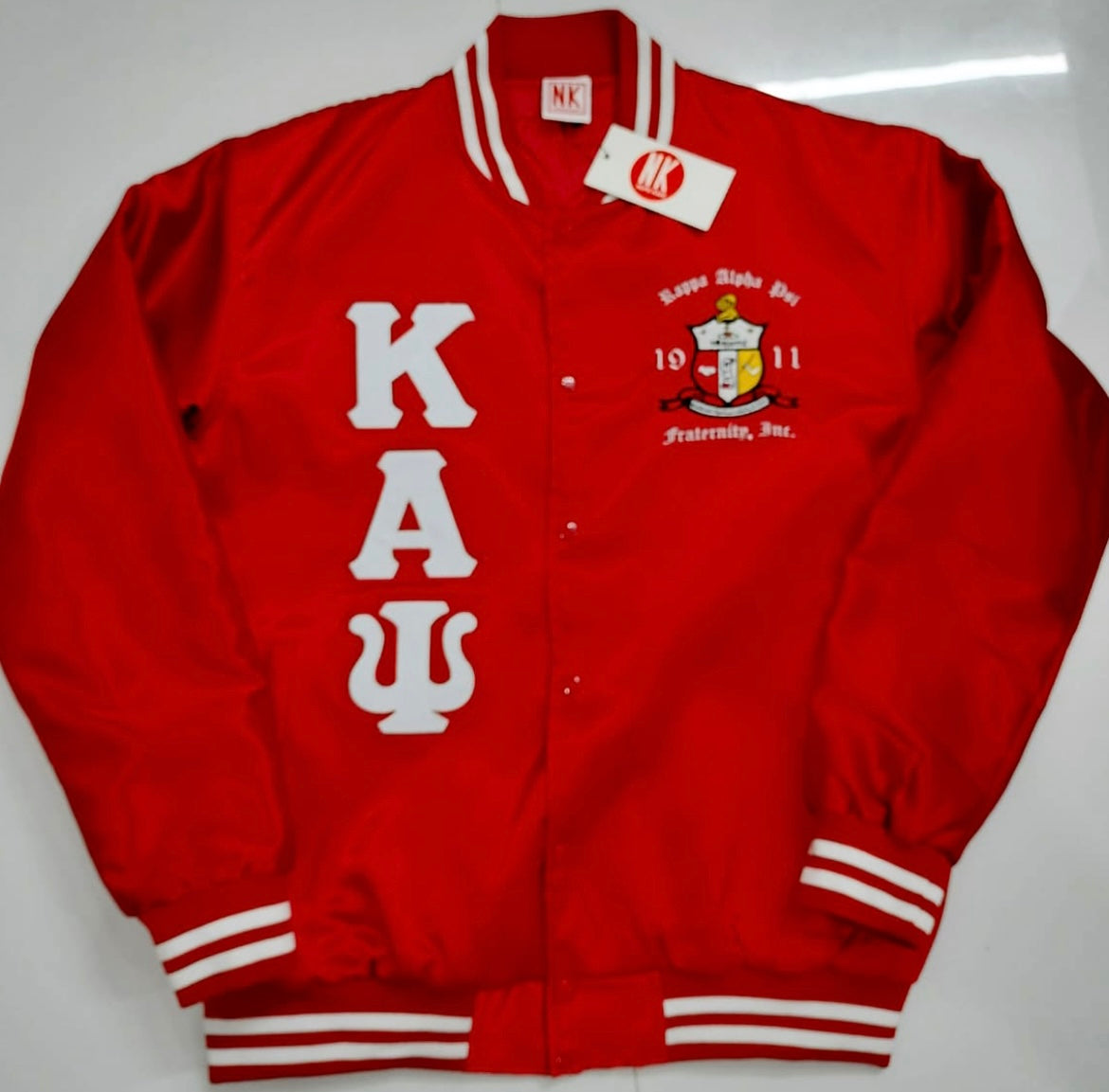Check out our Kappa Alpha Psi satin jacket selection for the very best in unique design. This Kappa Alpha Psi Baseball Satin Jacket shows the fraternity Shield embroidered on left chest and Greek letters on right to create style and unique comfort in wear. Quality beyond imagination.