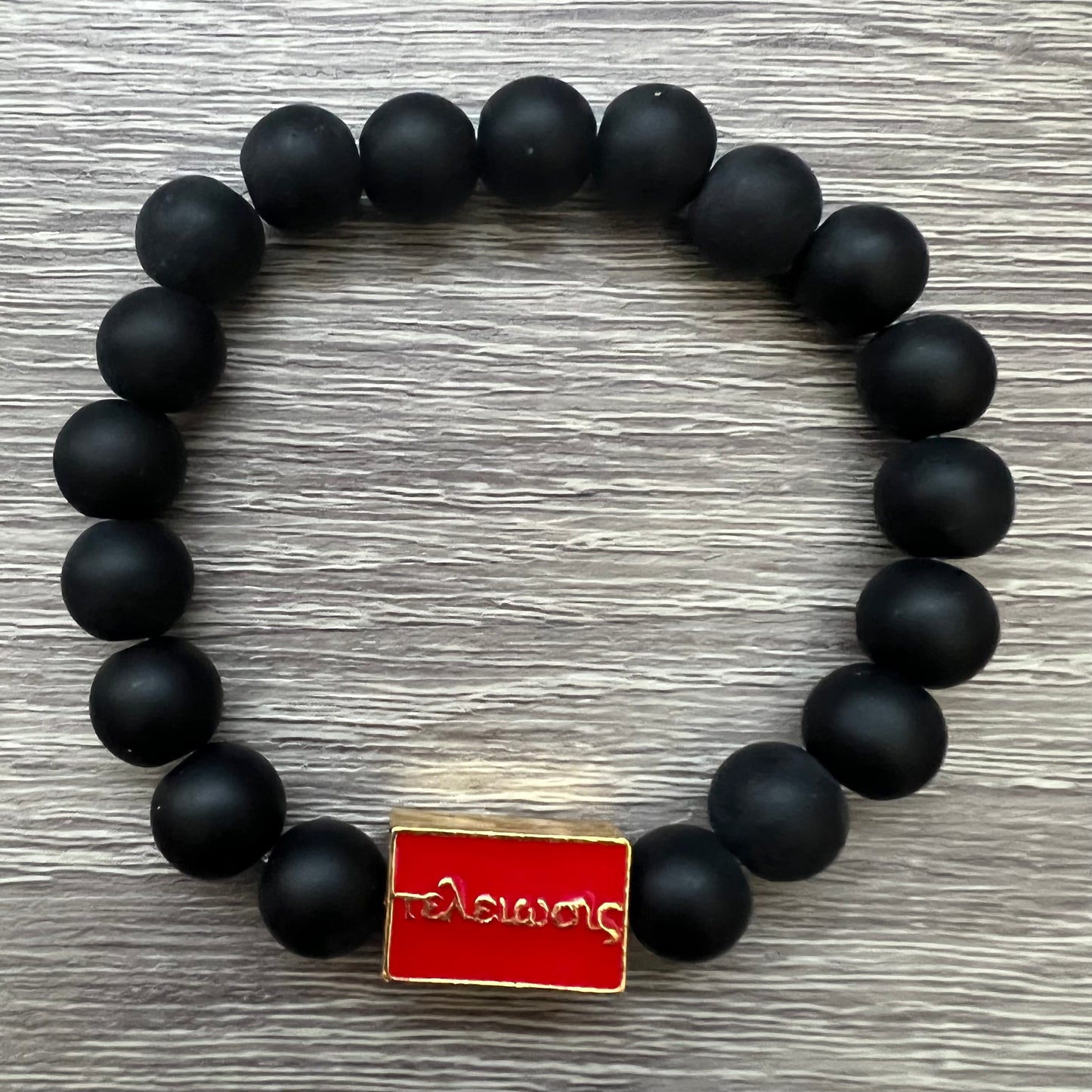 Kappa Alpha Psi fraternity exclusive Glass Beaded Bracelet on elastic stretch rope; simple and elegant. Easy bracelet to slide on and off wrist. The color of amber beads may vary from bracelet to bracelet due to each bracelet being hand made from natural materials with a personal touch.