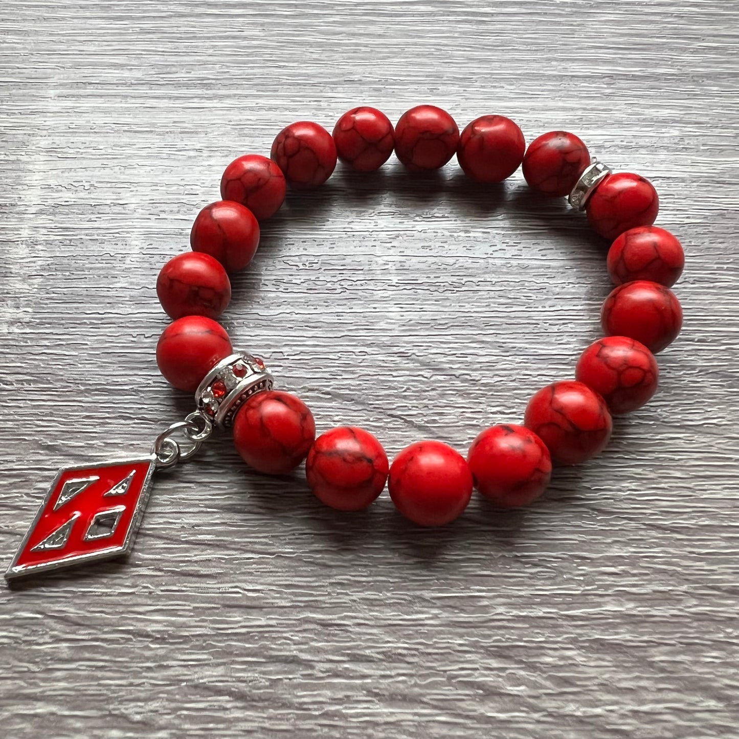 Kappa Alpha Psi fraternity exclusive Glass Beaded Bracelet on elastic stretch rope; simple and elegant. Easy bracelet to slide on and off wrist. The color of amber beads may vary from bracelet to bracelet due to each bracelet being hand made from natural materials with a personal touch.