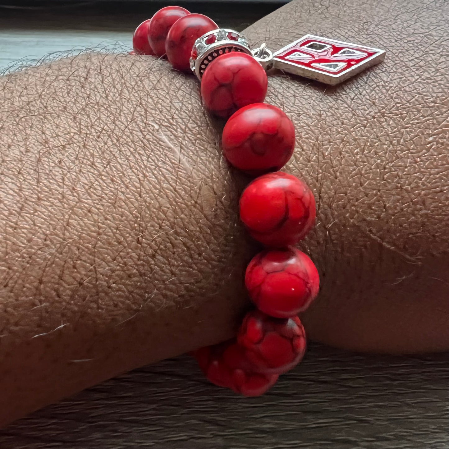 Kappa Alpha Psi fraternity exclusive Glass Beaded Bracelet on elastic stretch rope; simple and elegant. Easy bracelet to slide on and off wrist. The color of amber beads may vary from bracelet to bracelet due to each bracelet being hand made from natural materials with a personal touch.
