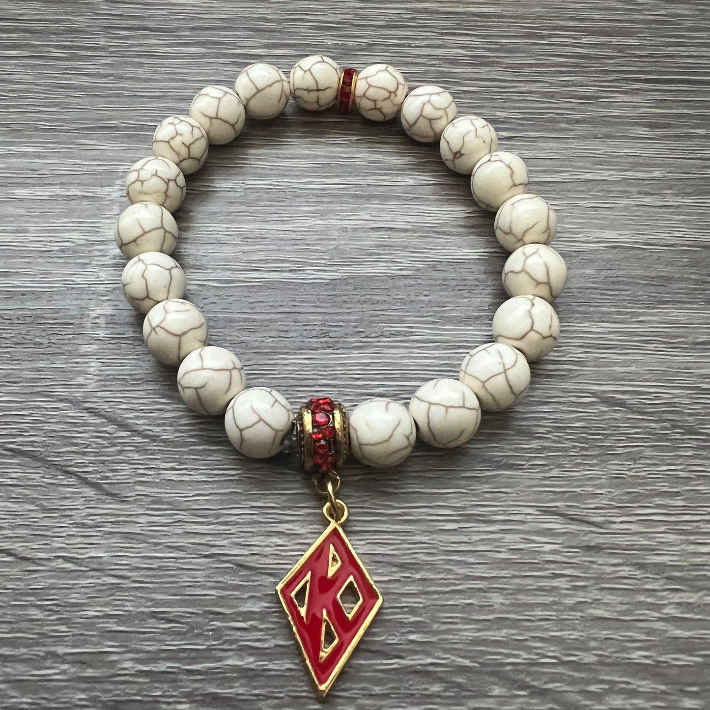 Kappa Alpha Psi fraternity exclusive Glass Beaded Bracelet on elastic stretch rope; simple and elegant. Easy bracelet to slide on and off wrist. The color of amber beads may vary from bracelet to bracelet due to each bracelet being hand made from natural materials with a personal touch.