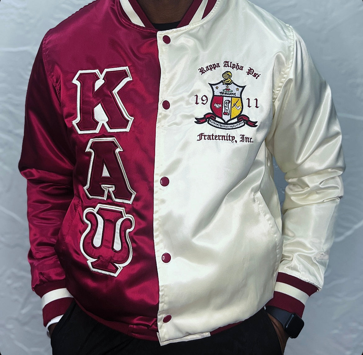 Show off your Kappa Alpha Psi pride with this stylish satin baseball jacket. Featuring the fraternity's iconic colors and crest, this jacket is perfect for any member of Kappa Alpha Psi. Made with high-quality materials, this jacket is not only fashionable but also durable. Represent your organization in style with this must-have addition to your wardrobe.
