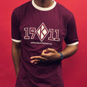 Made with high-quality materials, this shirt is perfect for any occasion. Whether you're heading to a chapter meeting, a Greek event, or just hanging out with your brothers, this shirt is sure to make a statement. Don't miss out on the opportunity to add this unique and rare piece to your collection.