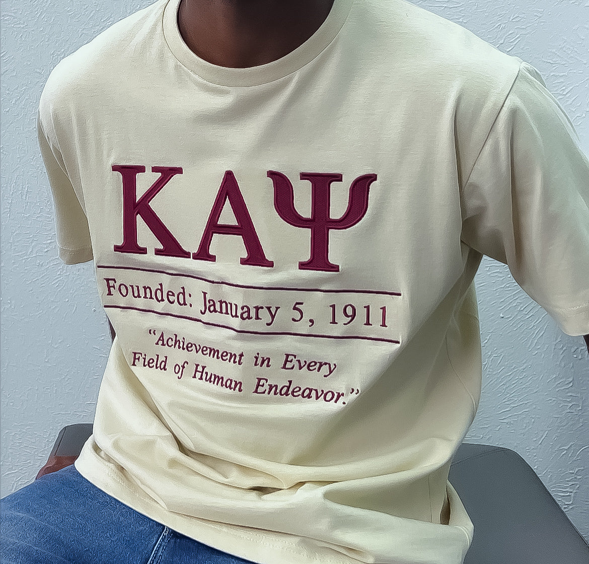 Show off your Kappa Alpha Psi pride with this stunning Embroidery and Chenille Shield T Shirt in Cream and Crimson colors. Perfect for members and supporters of the Fraternity &amp; Organization, this shirt is a must-have for any fan of historical memorabilia.