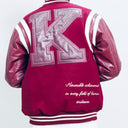 Maroon letterman jacket with a large 'K' on the back, worn by a person.The Kappa Alpha Psi Letterman Varsity Jacket is a collectible item that showcases the history and symbolism of the fraternity organization. Made with durable materials, this jacket is designed to last and serve as a tangible reminder of the values and traditions upheld by members of Kappa Alpha Psi. Perfect for Nupe looking to show their pride and affiliation with the organization, this jacket is a piece of fraternal memorabilia.