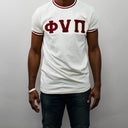 Featuring the iconic Phi Nu Pi logo, this shirt is a must-have for any member of the fraternity. The bold cream color is sure to make you stand out in a crowd, and the shirt's classic design means it will never go out of style. So why wait? Add this Phi Nu Pi T-shirt to your collection today and show off your love for one of the most respected fraternities in the world.
