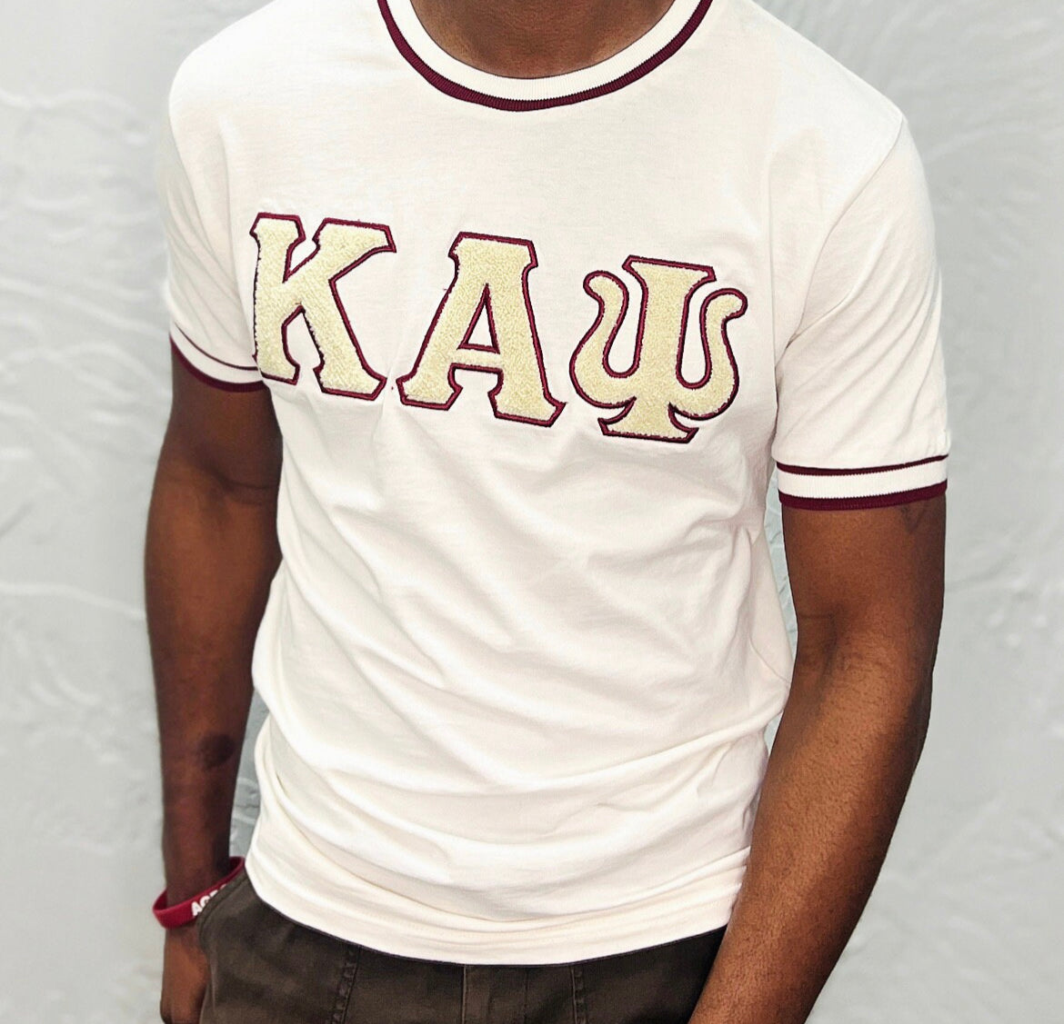 Show off your love for Kappa Alpha Psi fraternity with this stylish and eye-catching red T-shirt from the world brand of Nupe Kave. Perfect for any occasion, this shirt is made from high-quality materials and is designed to be comfortable and durable. Whether you're attending a social event or relaxing at home, this shirt is sure to turn heads.