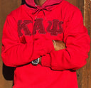 Stay warm and cozy with this Kappa Alpha Psi Red Shield Hoodie. Designed with the fraternity members in mind, it features the iconic shield logo on the front and is perfect for any member Kappa Alpha Psi. Made with high-quality materials, this hoodie is durable and built to last through the years. Whether you're out and about or lounging at home, this hoodie is a must-have item for any Kappa Alpha Psi organization member.
