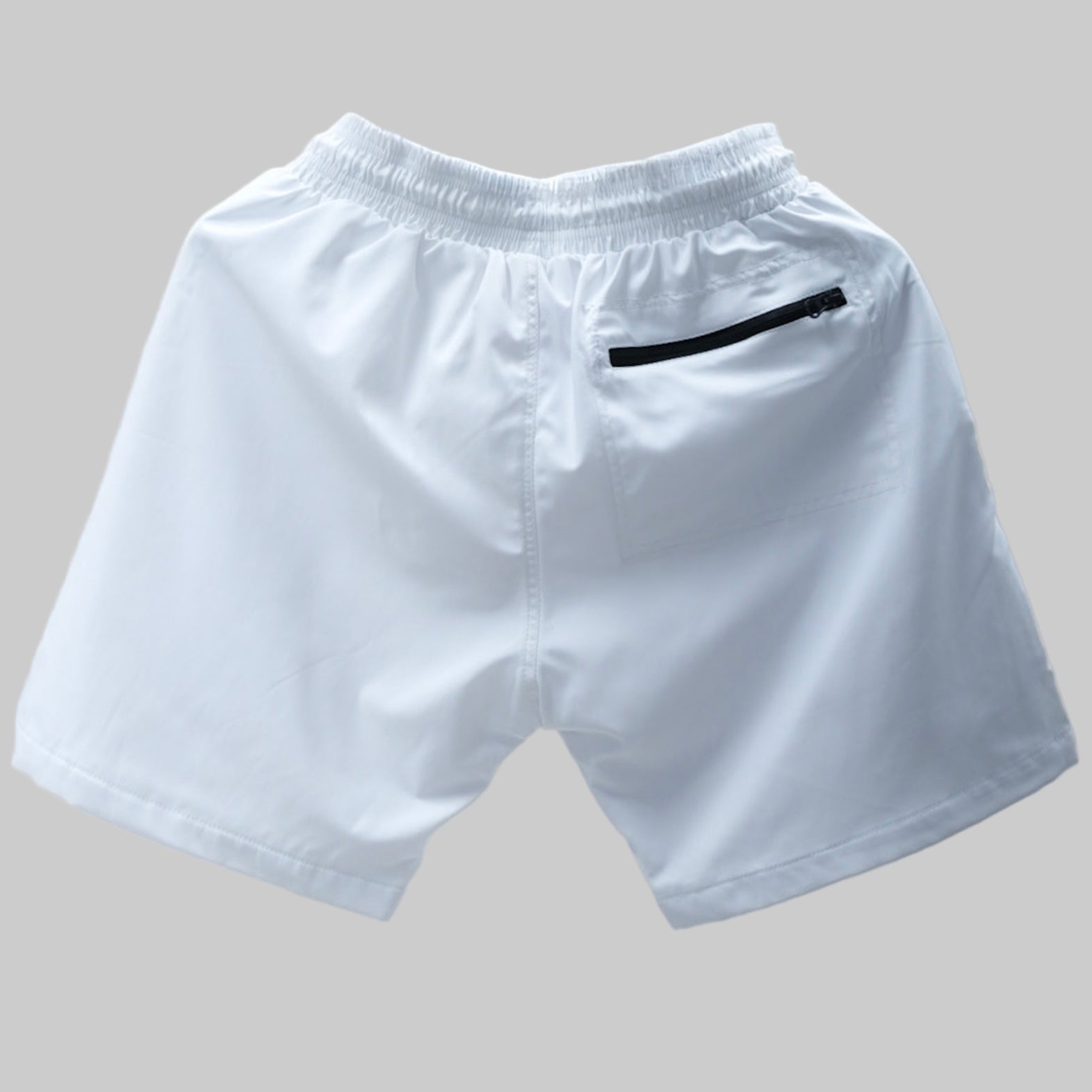 Get ready for summer with these Kappa Alpha Psi “NUPE” shorts! Perfect for any fraternity functions , these shorts are a must-have addition to your summer wardrobe. Made with high-quality materials, they are both comfortable and stylish.

White shorts with a black zipper pocket on a gray background