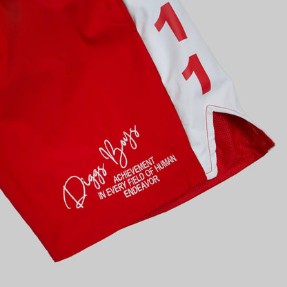 Red shorts with white text and logo on a light gray background.The Kappa Alpha Psi red Summer Short is a collectible item that represents the historical memorabilia of Kappa Alpha Psi Fraternity Inc . It is a symbol of pride and heritage for members of the Kappa Alpha Psi Fraternity, showcasing their commitment to their values and traditions from 1911. This short is a tangible piece of history that serves as a reminder of the legacy and contributions of the organization.