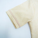 Folded beige towel with red stripes on a light gray background.The product is Kappa Alpha Psi African Wear, specifically designed for members of the prestigious African American fraternity. This apparel is a symbol of pride and unity among the members of the organization, showcasing their heritage and cultural background. With the iconic symbols and colors of Kappa Alpha Psi, this African wear is a must-have for any member looking to represent their fraternity in a stylish and meaningful way.