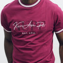 This Kappa Alpha Psi Premium NUPE Crimson T-Shirt is a must-have for any member of the organization. Made of high-quality cotton material, this regular-fit T-shirt features a crew neck and short sleeves, making it perfect for everyday wear. The shirt comes in a cream color with a solid pattern, and the Kappa Alpha Psi brand is prominently displayed on the front.