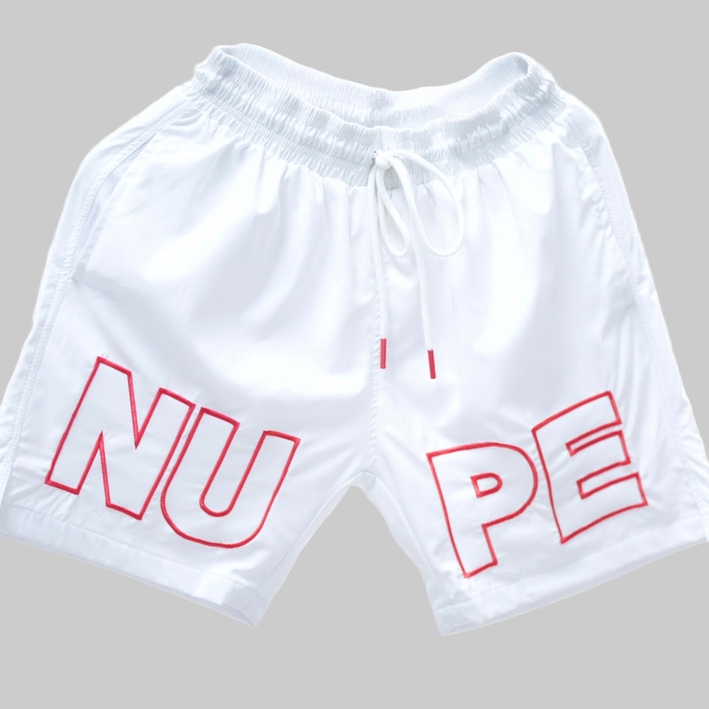 Get ready for summer with these Kappa Alpha Psi “NUPE” shorts! Perfect for any fraternity functions , these shorts are a must-have addition to your summer wardrobe. Made with high-quality materials, they are both comfortable and stylish.

White shorts with red text on a light gray background