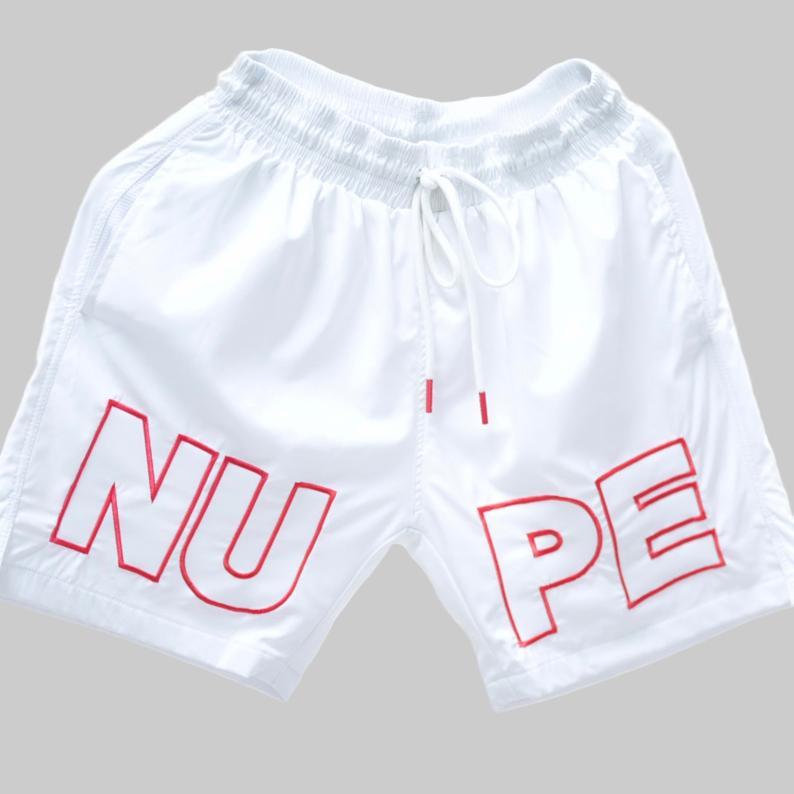 Get ready for summer with these Kappa Alpha Psi “NUPE” shorts! Perfect for any fraternity functions , these shorts are a must-have addition to your summer wardrobe. Made with high-quality materials, they are both comfortable and stylish.

White shorts with red text on a light gray background