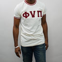Featuring the iconic Phi Nu Pi logo, this shirt is a must-have for any member of the fraternity. The bold cream color is sure to make you stand out in a crowd, and the shirt's classic design means it will never go out of style. So why wait? Add this Phi Nu Pi T-shirt to your collection today and show off your love for one of the most respected fraternities in the world.