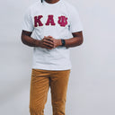 Show off your love for Kappa Alpha Psi with this stylish t-shirt. Made of high-quality cotton material, this white colored shirt features a solid pattern and short sleeves with a crew neckline. The regular fit shirt is perfect for any occasion and can be worn by any member of Kappa Alpha Psi.