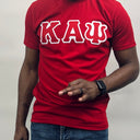 This Kappa Alpha Psi Fraternity Embroidery Shirt is a must-have for any member of the organization. The red shirt features stunning embroidery that proudly displays the Fraternity's letters . It is perfect for any occasion, whether you are attending a formal event or just hanging out with the Nupes .
