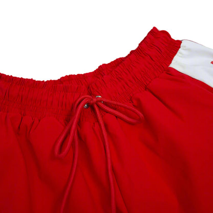 Red shorts with a white drawstring on a light gray background.The Kappa Alpha Psi red Summer Short is a collectible item that represents the historical memorabilia of Kappa Alpha Psi Fraternity Inc . It is a symbol of pride and heritage for members of the Kappa Alpha Psi Fraternity, showcasing their commitment to their values and traditions from 1911. This short is a tangible piece of history that serves as a reminder of the legacy and contributions of the organization.