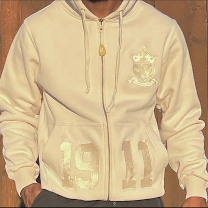 Stay warm and cozy with this Kappa Alpha Psi Cream Shield Hoodie. Designed with the fraternity members in mind, it features the iconic shield logo on the front and is perfect for any member Kappa Alpha Psi. Made with high-quality materials, this hoodie is durable and built to last through the years. Whether you're out and about or lounging at home, this hoodie is a must-have item for any Kappa Alpha Psi organization member.