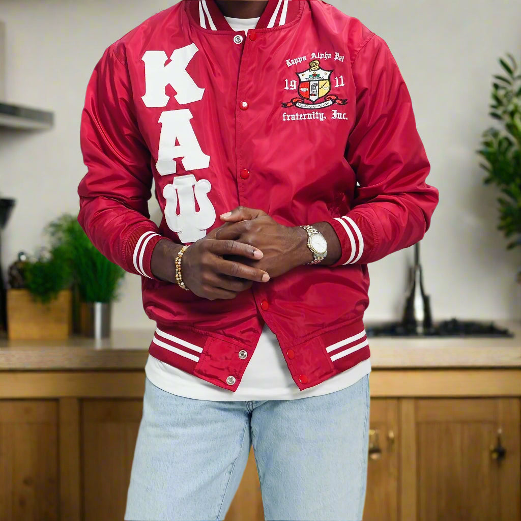 Check out our Kappa Alpha Psi satin jacket selection for the very best in unique design. This Kappa Alpha Psi Baseball Nylon Jacket shows the fraternity Shield embroidered on left chest and Greek letters on right to create style and unique comfort in wear. Quality beyond imagination.

