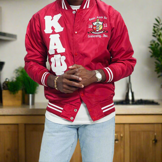 Check out our Kappa Alpha Psi satin jacket selection for the very best in unique design. This Kappa Alpha Psi Baseball Nylon Jacket shows the fraternity Shield embroidered on left chest and Greek letters on right to create style and unique comfort in wear. Quality beyond imagination.
