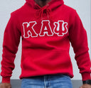 Elevate your casual wear game with this Kappa Alpha Psi Red Hoodie. The iconic brand of Kappa, known for its premium quality and design, makes this hoodie a must-have for men who appreciate style and comfort. The vibrant red color adds a pop of color to any outfit and is perfect for any occasion.