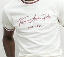 This Kappa Alpha Psi Premium NUPE Cream T-Shirt is a must-have for any member of the organization. Made of high-quality cotton material, this regular-fit T-shirt features a crew neck and short sleeves, making it perfect for everyday wear. The shirt comes in a cream color with a solid pattern, and the Kappa Alpha Psi brand is prominently displayed on the front.