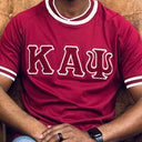 Show off your love for Kappa Alpha Psi fraternity with this stylish and eye-catching red T-shirt from the world brand of Nupe Kave. Perfect for any occasion, this shirt is made from high-quality materials and is designed to be comfortable and durable. Whether you're attending a social event or relaxing at home, this shirt is sure to turn heads.