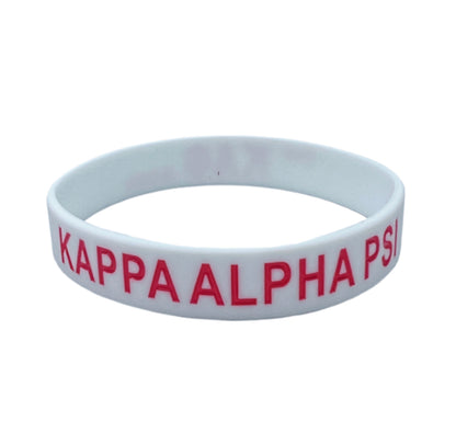 Show your pride for Kappa Alpha Psi with this "THE BOND" silicone band. Perfect for fraternity members, this collectible is a must-have for any historical memorabilia or fraternal organization enthusiast. The bold design features the iconic Kappa Alpha Psi emblem, making it a great addition to any jewelry collection. Made of high-quality silicone, this band is durable and suitable for everyday wear.