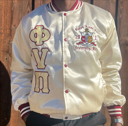 Check out our Kappa Alpha Psi satin jacket selection for the very best in unique design. This Kappa Alpha Psi Baseball Satin Jacket shows the fraternity Shield embroidered on left chest and Greek letters on right to create style and unique comfort in wear. Quality beyond imagination.