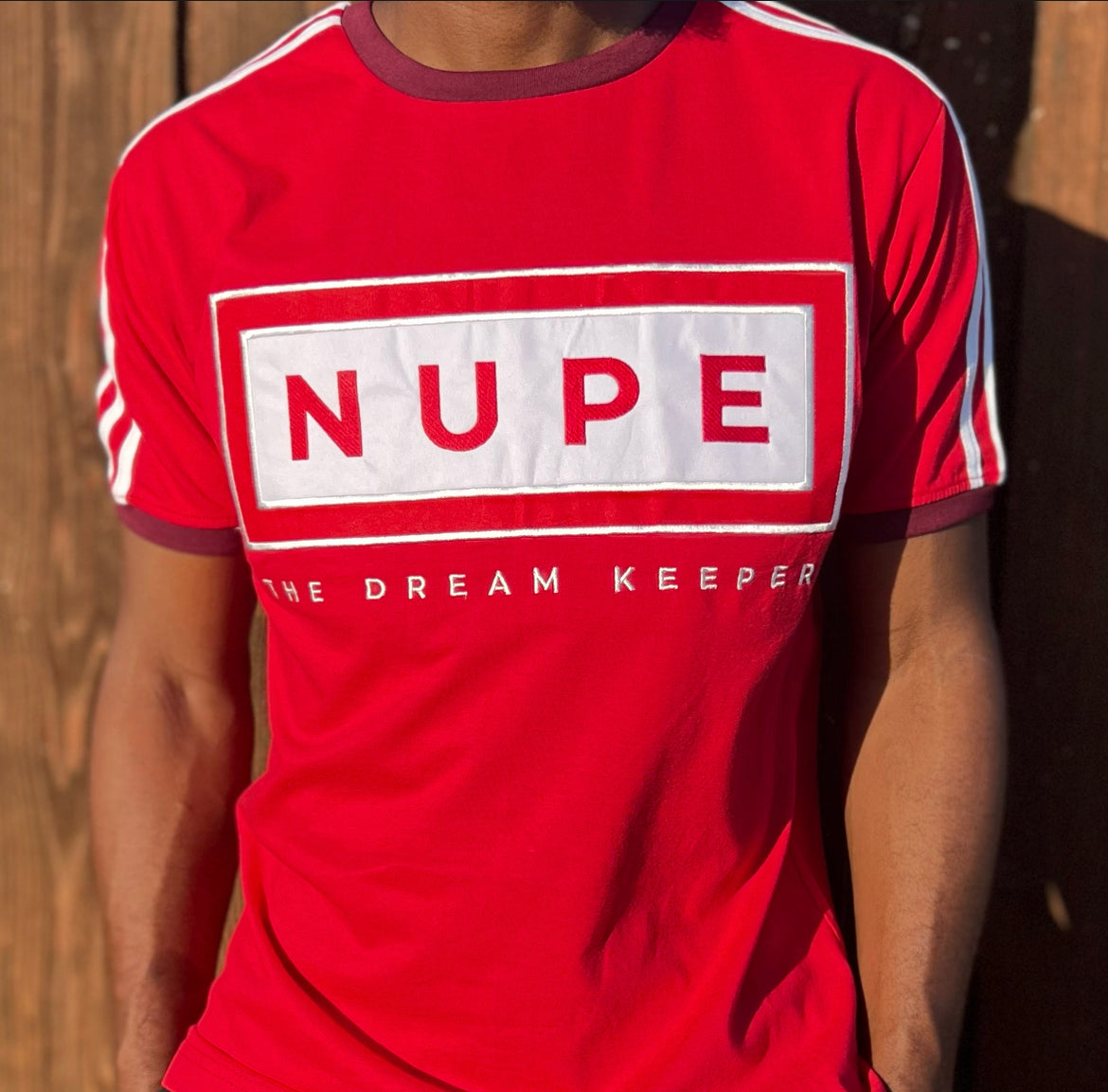 This Kappa Alpha Psi Embroidery "NUPE" T-Shirt is a must-have for any of the Fraternity member. The shirt comes in a vibrant red and white color combination that is sure to make a statement. With high-quality embroidery that is built to last, this T-shirt is perfect for showing off your pride in your organization.