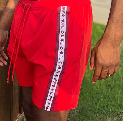 Enjoy your spring & summer with a Nupe Kave shorts constructed from a premium polyester blend that is ultra-soft and comfortable. This short is lightweight with moisture-wicking fabric is antimicrobial to keep you dry and feeling fresh. Perfect for an early morning workout or dip in the ocean while on vacation. Finished with pockets and an elasticated waist band with drawstrings for the phones and extra items.