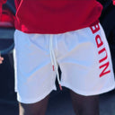“NUPE” White Shorts