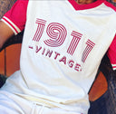 This Kappa Alpha Psi T-Shirt is a must-have for any fraternity member. The vintage design showcases the year the organization was founded, 1911. Made by the Nupe Kave brand , this high-quality shirt is perfect for men who want to show their pride in style. Available in various sizes, this T-Shirt is perfect for any occasion. The shirt is made from durable and comfortable material, ensuring that it will last for years to come.