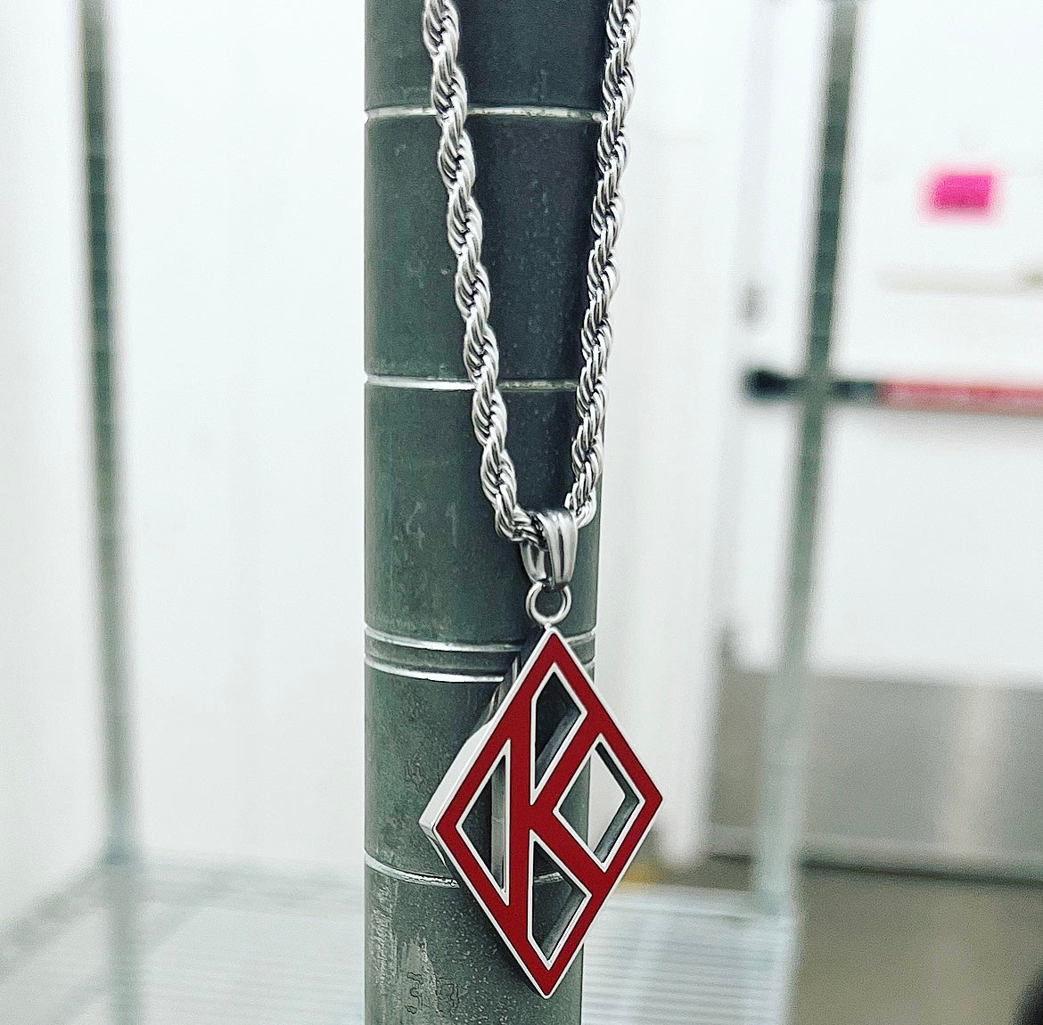 This stunning men's jewelry piece is the perfect way to show off your affiliation with Kappa Alpha Psi. The bold red color and intricate design make it a true standout accessory that will complement any outfit. Ideal for members of Kappa Alpha Psi fraternities , this necklace is a must-have for any collection.