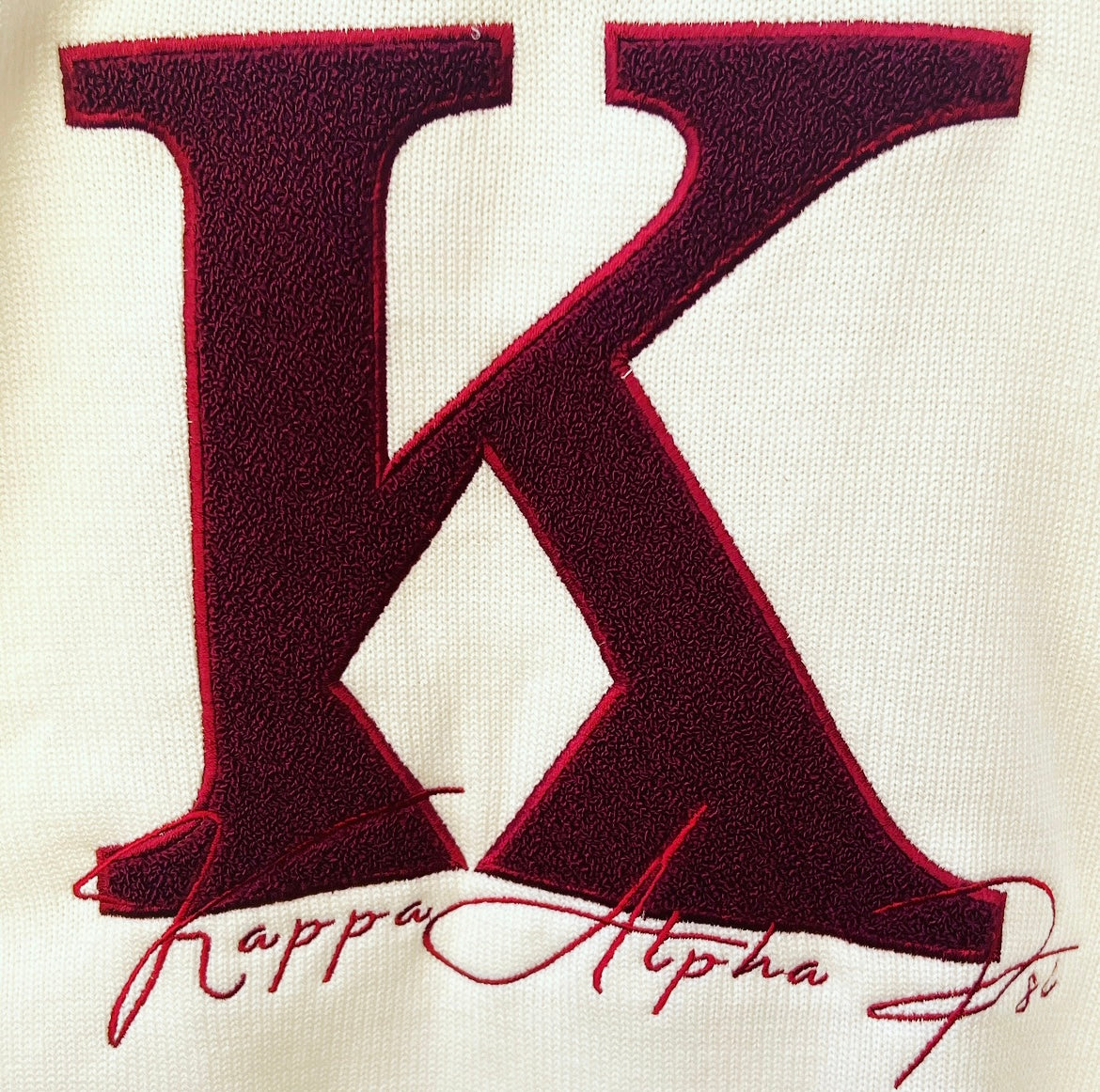 Exclusive Kappa Alpha Psi Chenille Appliqué Embroidery Crimson Sweater. This is the perfect long-sleeved Sweater to wear while showing off your Kappa Alpha Psi fraternity . A comfortable 100% Acrylic with a Chenille K diamond and Kappa Alpha Psi embroidery across the chest give you the perfect fit. This sweater is also a perfect gift for your favorite Kappa Man.