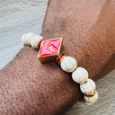 Kappa Alpha Psi fraternity exclusive Glass Beaded Bracelet on elastic stretch rope; simple and elegant. Easy bracelet to slide on and off wrist. The color of amber beads may vary from bracelet to bracelet due to each bracelet being hand made from natural materials with a personal touch.