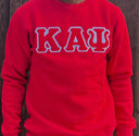 Exclusive Kappa Alpha Psi Double Stitched Appliqué Embroidery Lettered Red Sweater. This is the perfect long-sleeved Sweater to wear while showing off your Kappa Alpha Psi fraternity lettering. A comfortable 100% cotton tee with a twill Greek letters embroidery across the chest give you the perfect fit. This sweater is also a perfect gift for your favorite Kappa Man.