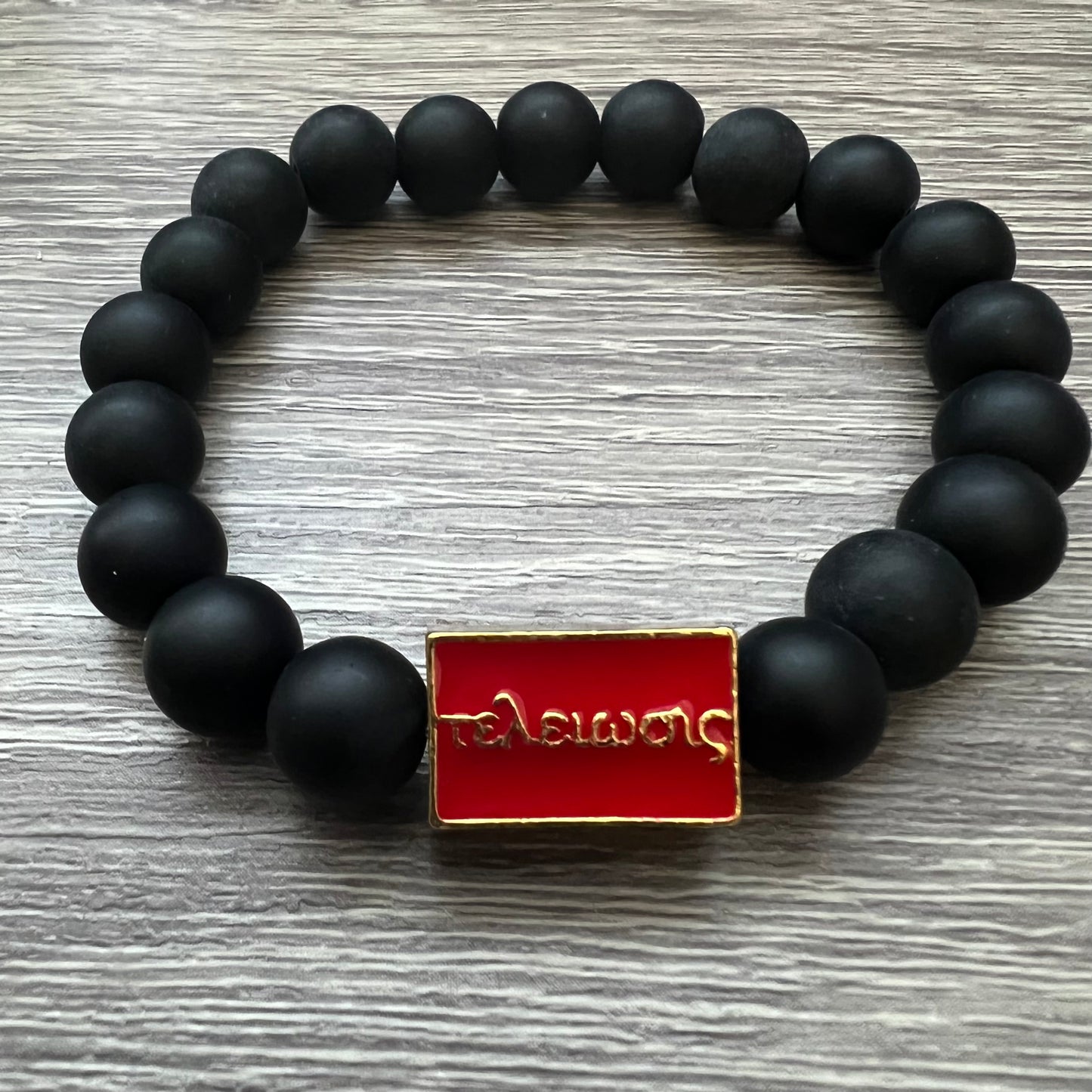 Kappa Alpha Psi fraternity exclusive Glass Beaded Bracelet on elastic stretch rope; simple and elegant. Easy bracelet to slide on and off wrist. The color of amber beads may vary from bracelet to bracelet due to each bracelet being hand made from natural materials with a personal touch.