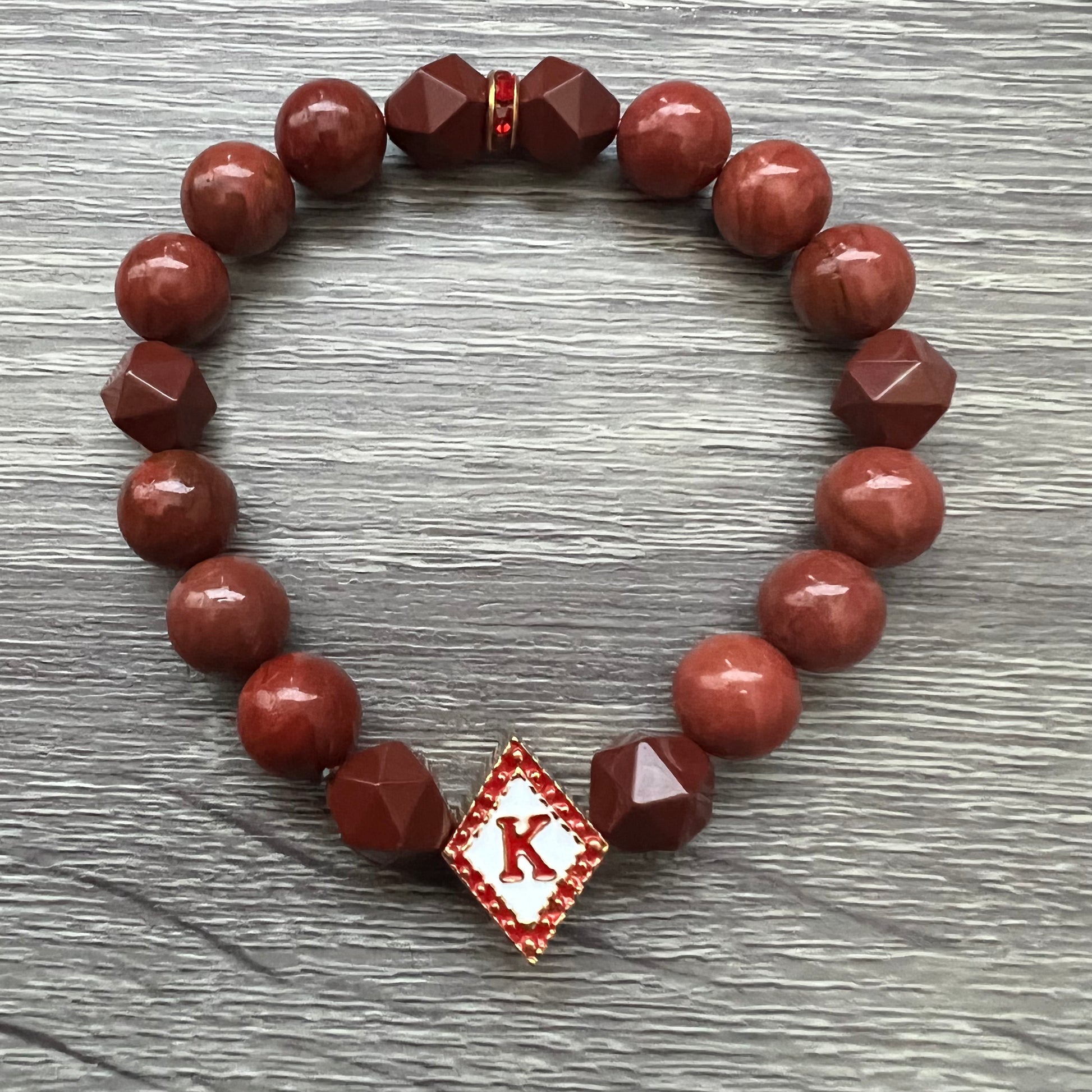 Kappa Alpha Psi fraternity exclusive Glass Beaded Bracelet on elastic stretch rope; simple and elegant. Easy bracelet to slide on and off wrist. The color of amber beads may vary from bracelet to bracelet due to each bracelet being hand made from natural materials with a personal touch.