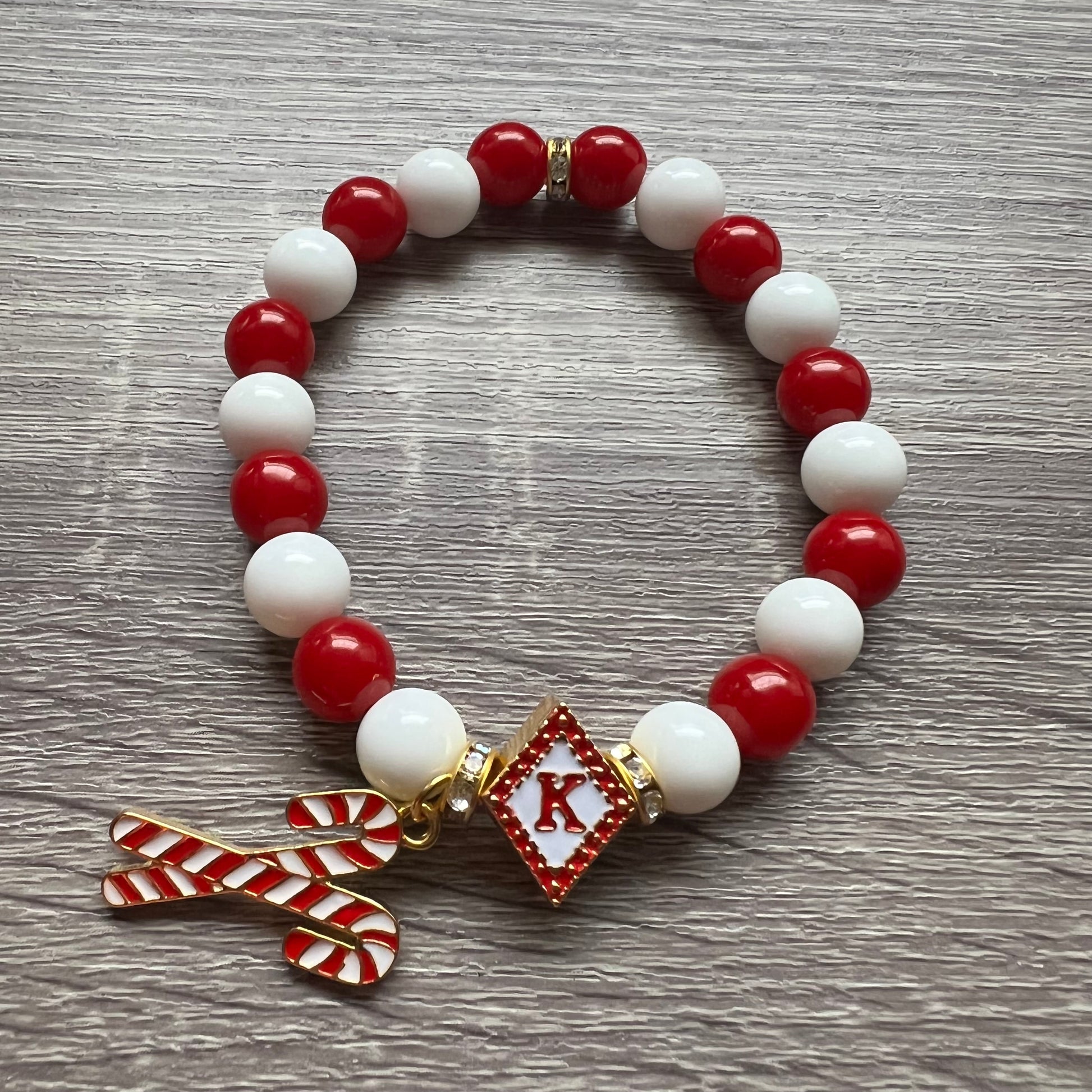 Kappa Alpha Psi fraternity exclusive Glass Beaded Bracelet on elastic stretch rope; simple and elegant. Easy bracelet to slide on and off wrist. The color of amber beads may vary from bracelet to bracelet due to each bracelet being hand made from natural materials with a personal touch.