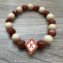 Kappa Alpha Psi fraternity exclusive Glass Beaded Bracelet on elastic stretch rope; simple and elegant. Easy bracelet to slide on and off wrist. The color of amber beads may vary from bracelet to bracelet due to each bracelet being hand made from natural materials with a personal touch.