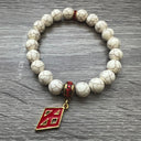 Kappa Alpha Psi fraternity exclusive Glass Beaded Bracelet on elastic stretch rope; simple and elegant. Easy bracelet to slide on and off wrist. The color of amber beads may vary from bracelet to bracelet due to each bracelet being hand made from natural materials with a personal touch.
